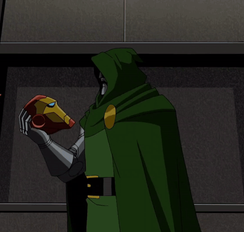 A Man In A Red Suit And A Man In A Green Cape Standing Next To Each Other GIF