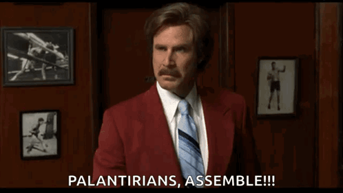 A Man In A Red Suit And Tie Is Saying " Palantirians Assemble !!! " GIF
