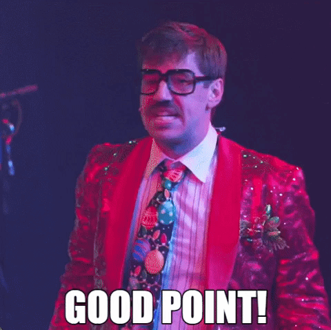 A Man In A Red Suit And Tie Says Good Point GIF