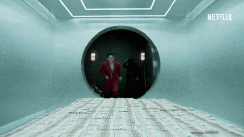 A Man In A Red Suit Stands In A Room With A Stack Of Money On The Floor And A Netflix Logo GIF