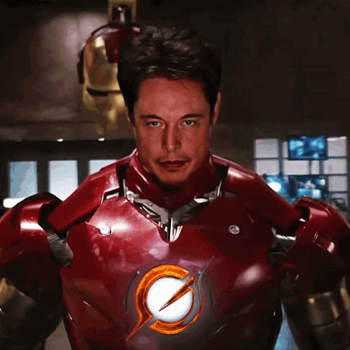 A Man In A Red Suit With A Lightning Bolt On The Chest GIF