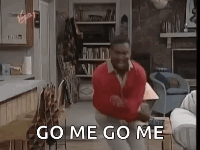 A Man In A Red Sweater Is Dancing In A Living Room While Saying `` Go Me Go Me '' . GIF
