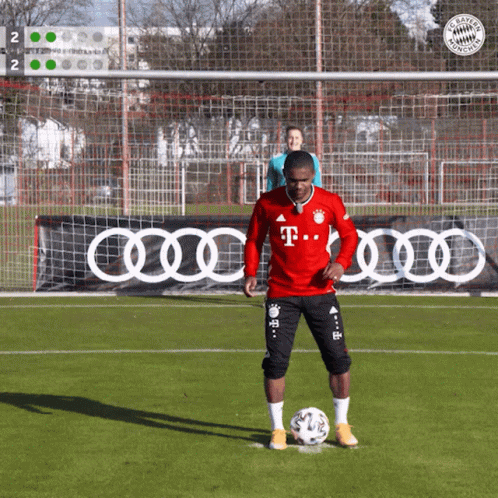 A Man In A Red T-Mobile Jersey Kicking A Soccer Ball GIF