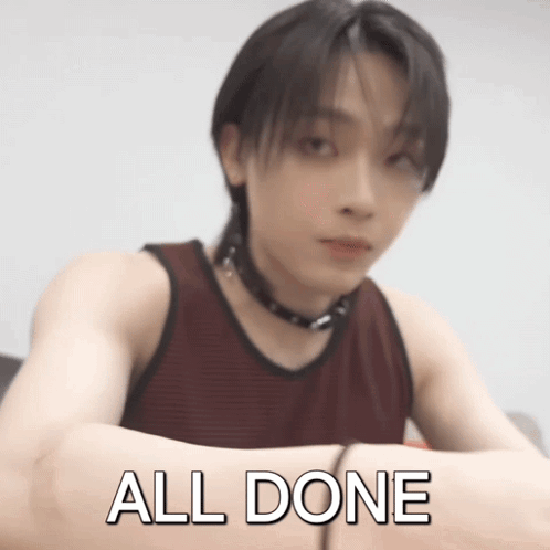A Man In A Red Tank Top Has His Arms Crossed And The Words All Done Written On His Arm GIF