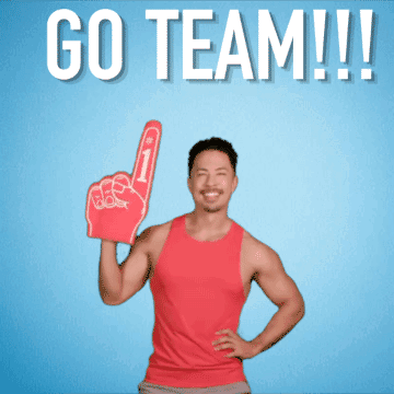 A Man In A Red Tank Top Holds Up A Foam Finger And Says " Go Team " GIF