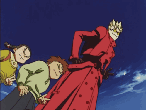 A Man In A Red Trench Coat Is Pointing At Something GIF