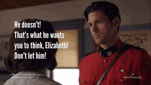 A Man In A Red Uniform Is Talking To A Woman In A Hallmark Ad GIF