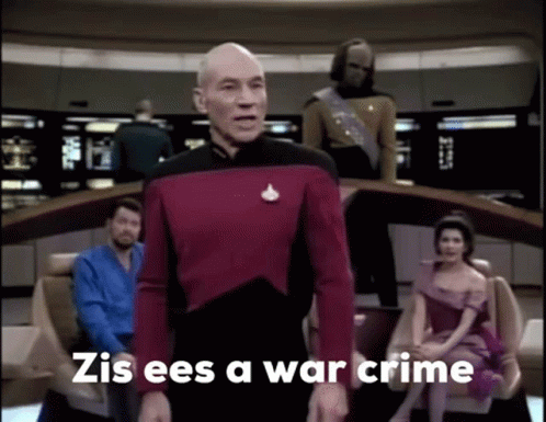 A Man In A Red Uniform Stands In Front Of A Group Of People And Says Zis Ees A War Crime . GIF