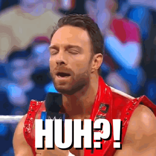 A Man In A Red Vest With The Word Huh Written On His Chest GIF