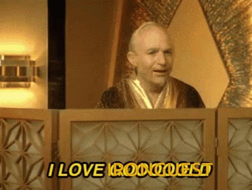A Man In A Robe Is Behind A Screen That Says I Love Roomquest GIF