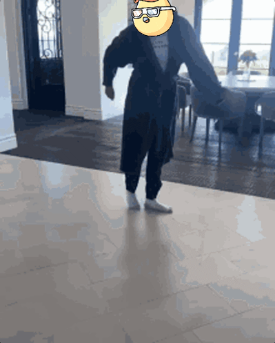 Man In Robe Dancing With Cartoon Face Head GIF