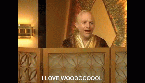 A Man In A Robe Is Standing In Front Of A Wooden Screen And Says `` I Love Woooooool '' . GIF