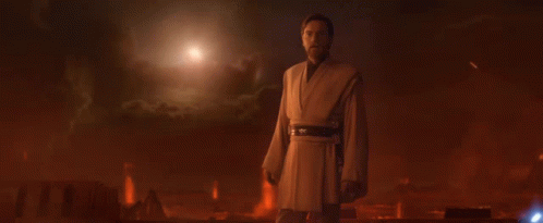 A Man In A Robe Stands In A Dark Room With The Words " Only A Sith Deals In Absolutes " Above Him GIF