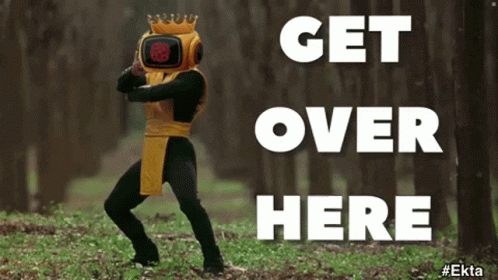 A Man In A Robot Costume Is Dancing In The Woods With The Words Get Over Here Below Him GIF