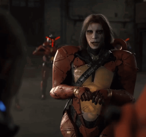 A Man In A Robotic Suit Has A Sticker On His Chest That Says ' X ' GIF