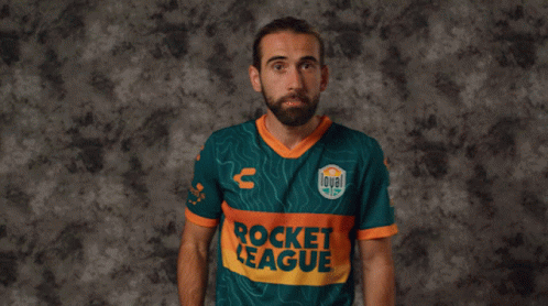 A Man In A Rocket League Jersey Holds A Red Card In Front Of His Face GIF