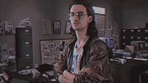 A Man In A Room With The Word Hackerman On The Screen GIF