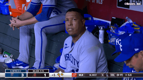 A Man In A Royals Jersey Sits In The Dugout Watching A Baseball Game GIF