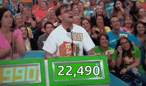 A Man In A Ryan Shirt Is Standing In Front Of A Crowd Of People GIF