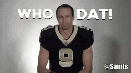 A Man In A Saints Jersey Is Standing In Front Of A White Background And Says Who Dat ! GIF