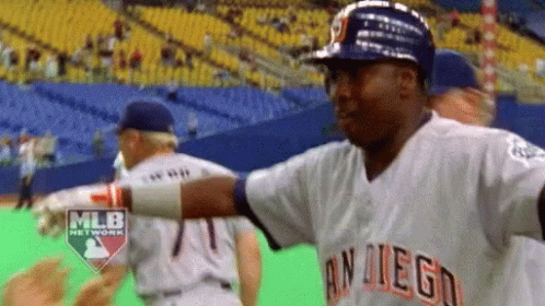 A Man In A San Diego Baseball Uniform Is Standing On A Baseball Field GIF