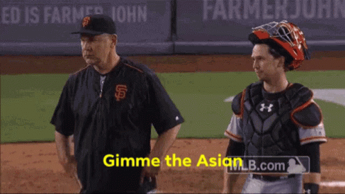 A Man In A San Francisco Giants Uniform Stands Next To A Catcher GIF