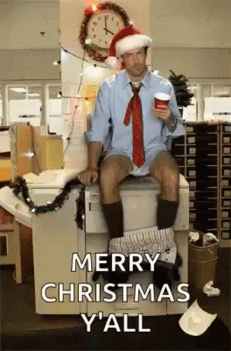 A Man In A Santa Hat Is Sitting On A Toilet GIF