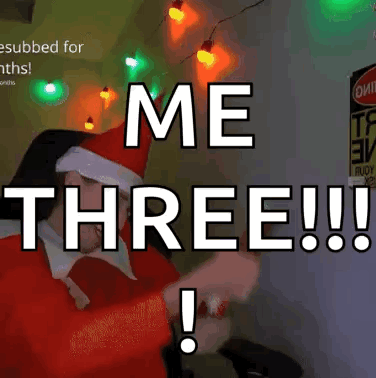 a man in a santa hat says me three !!