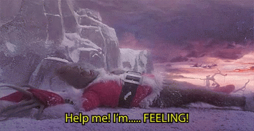 A Man In A Santa Suit Is Laying In The Snow And Says `` Help Me ! I 'M Feeling ! '' GIF
