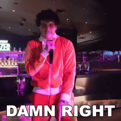 A Man In A Santa Suit Is Standing In Front Of A Sign That Says " Damn Right " GIF