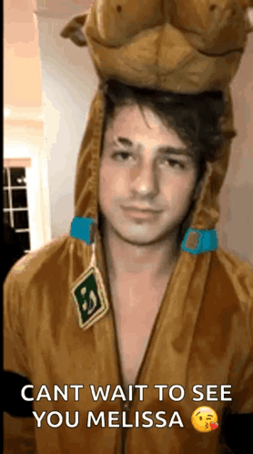 A Man In A Scooby Doo Costume Is Waiting To See His Girlfriend . GIF