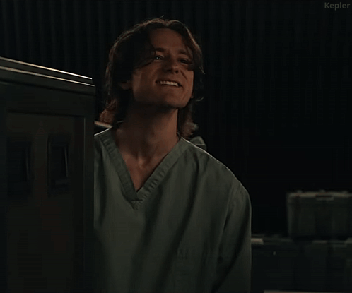 Man In Scrub Top Saying It's Getting Tense GIF