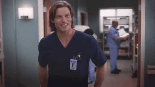 Man In Scrub Top With Dr. Name Tag GIF