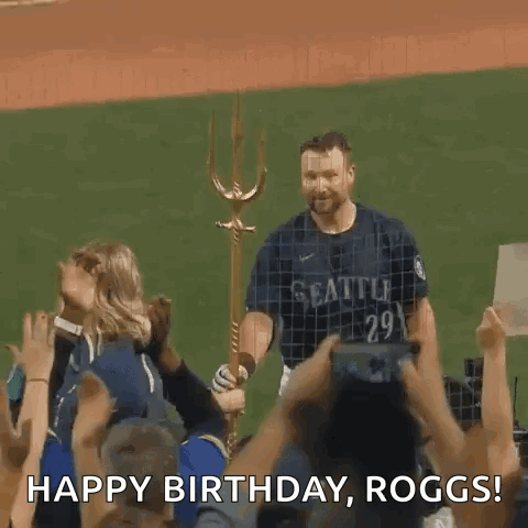A Man In A Seattle Jersey Is Standing In Front Of A Crowd Holding A Trident And Saying Happy Birthday Roggs GIF