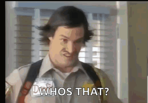 A Man In A Security Guard Uniform Is Asking Whos That . GIF