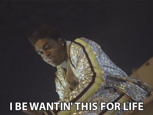 A Man In A Sequined Jacket With The Words I Be Wantin ' This For Life Below Him GIF