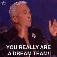 A Man In A Sequined Suit Is Saying You Really Are A Dream Team . GIF