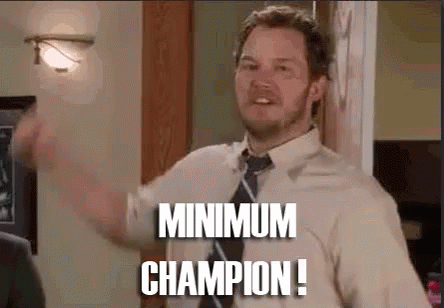 A Man In A Shirt And Tie Is Standing In A Room And Says `` Minimum Champion '' . GIF