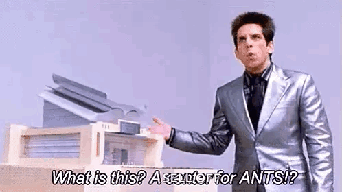 A Man In A Silver Suit Is Standing In Front Of A Printer And Asking What Is This ? A Scuttle For Ants ? GIF