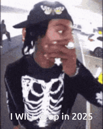 A Man In A Skeleton Shirt Is Smoking A Cigarette And Says `` I Will Drop In 2025 '' . GIF