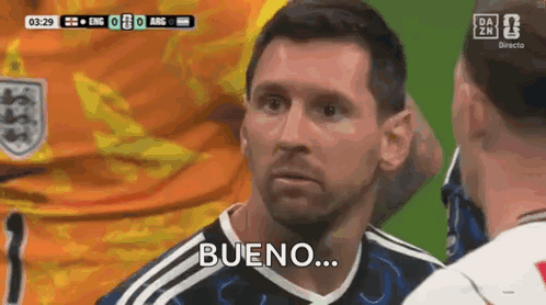 A Man In A Soccer Uniform Is Talking To Another Man And Says Bueno . GIF