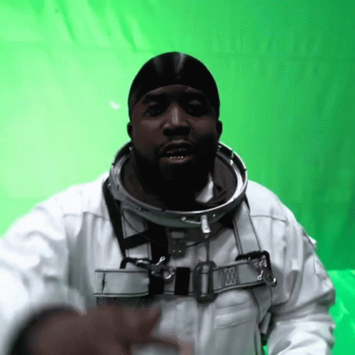 A Man In A Space Suit With A Collar That Says 000 GIF