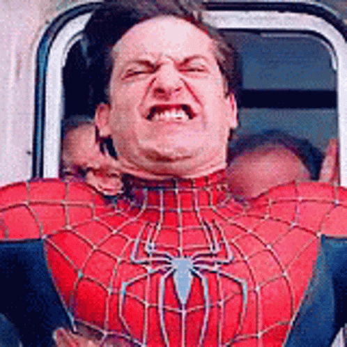 A Man In A Spider Man Costume Is Making A Funny Face . GIF