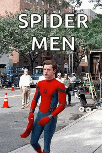 A Man In A Spider-Man Suit Is Walking Down A Sidewalk . GIF