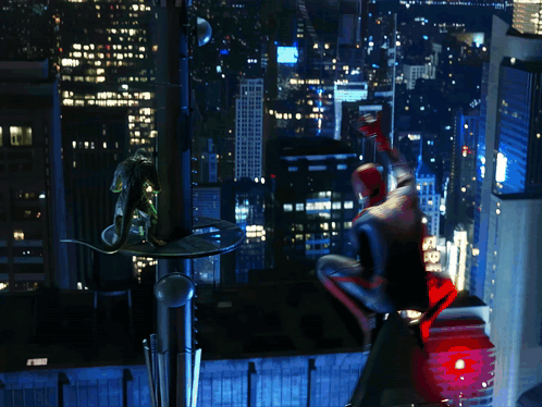A Man In A Spiderman Costume Is Flying Over A City GIF