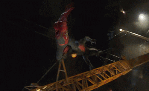 A Man In A Spiderman Costume Is Flying Through The Air GIF