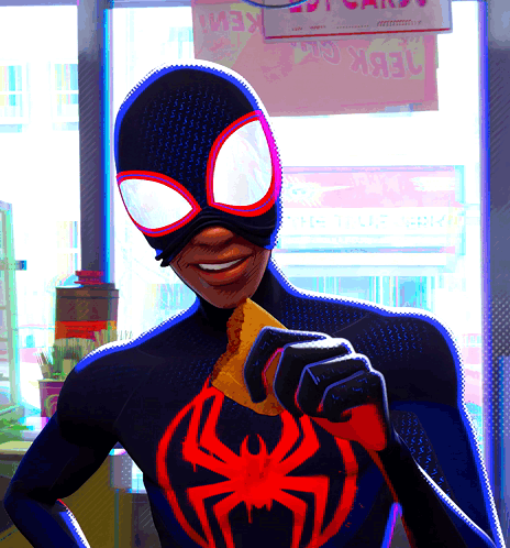 A Man In A Spiderman Costume Is Holding A Piece Of Food GIF