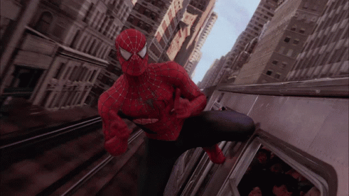 A Man In A Spiderman Costume Is Riding A Subway GIF