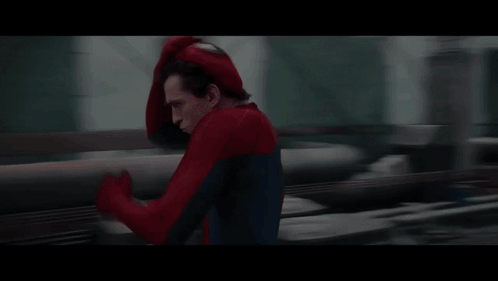A Man In A Spiderman Costume Is Running GIF
