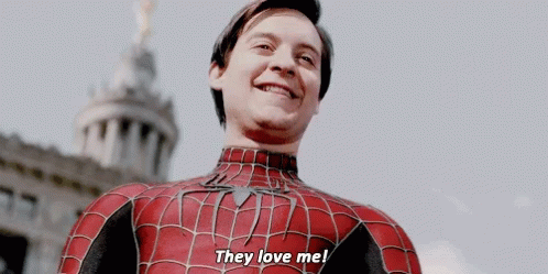A Man In A Spiderman Costume Is Smiling And Saying They Love Me GIF